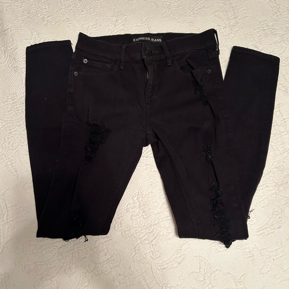 Express distressed legging Mid Rise.  Size 2 and black in color.
